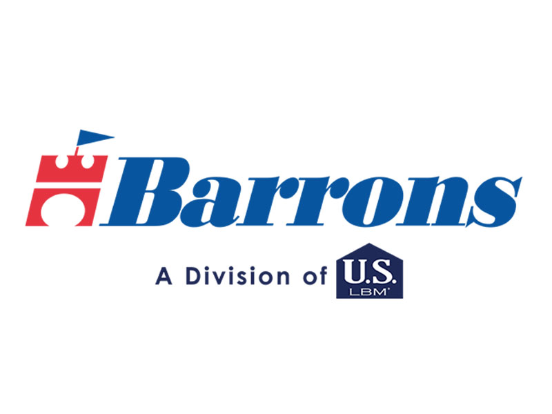 Close-up of framing lumber at a residential construction site, with wooden beams and trusses under a clear blue sky.